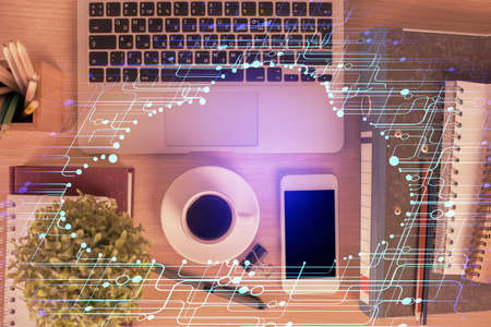 Double exposure of technology theme drawing over work table desktop. Top view. Global data analysis concept.の写真素材