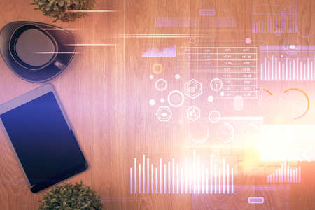 Double exposure of technology theme drawing over work table desktop. Top view. Global data analysis...