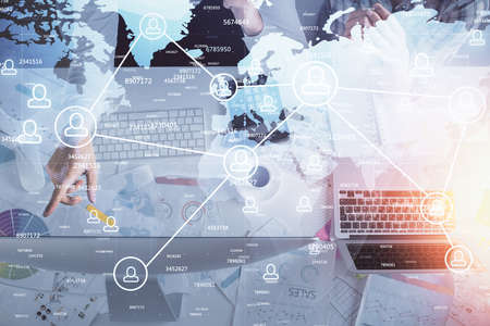 Double exposure of man and woman working together and social network theme hologram drawing....