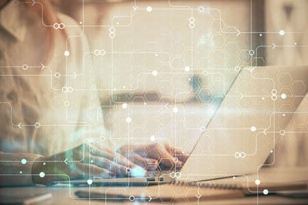 Multi exposure of woman hands working on computer and data theme hologram drawing. Tech concept.