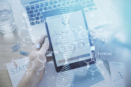 Double exposure of man's hands holding and using a phone and DNA drawing. Medical education concept.