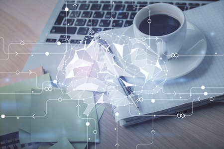 Double exposure of brain drawing and desktop with coffee and items on table background. Concept of...