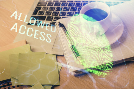 Double exposure of fingerprint drawing and desktop with coffee and items on table background. Concept of security.の写真素材