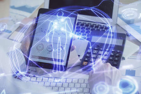 Double exposure of man's hands holding and using a phone and education theme drawing.