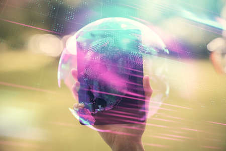 Double exposure of tech icon hologram and woman holding and using a mobile device. Technology...