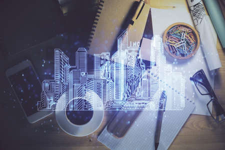 Double exposure of city drawing and work table top veiw. Concept of tech in live.の写真素材