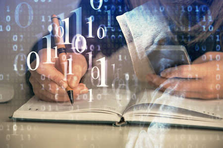 Multi exposure of woman hands working on computer and data theme hologram drawing. Tech concept.の写真素材