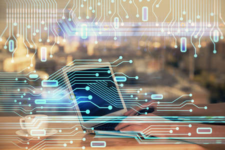 Multi exposure of woman hands working on computer and data theme hologram drawing. Tech concept.の写真素材