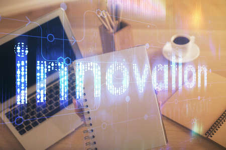 Multi exposure of woman hands working on computer and data theme hologram drawing. Tech concept.の写真素材