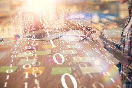 Multi exposure of woman hands working on computer and data theme hologram drawing. Tech concept.の写真素材