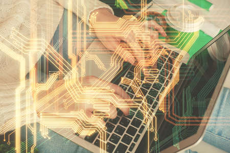 Double exposure of woman hands typing on computer and technology theme drawing. High Tech concept.の写真素材