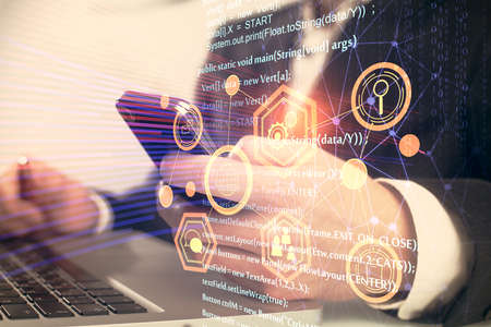 Multi exposure of man's hand holding and using a digital device and data theme drawing. Innovation...