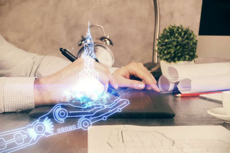 Double exposure of man's hands holding and using a mobile device and creative hologram drawing.の写真素材