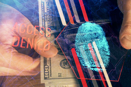 Multi exposure of fingerprint drawing hologram and USA dollars bills and man hands. security concept.の写真素材