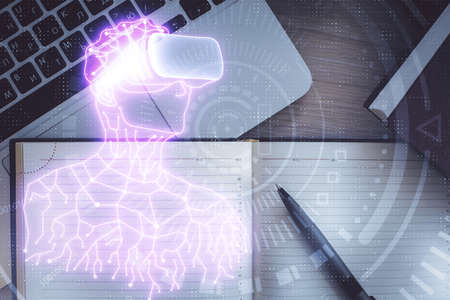 AR hologram drawings over computer on the desktop background. Top view. Multi exposure. Concept of...