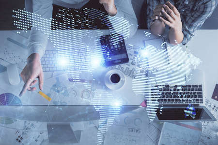 Double exposure of man and woman working together and social network theme hologram drawing....