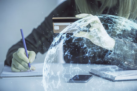 Multi exposure of woman on-line shopping holding a credit card and social network theme drawing....