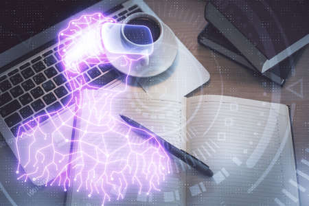 AR hologram drawings over computer on the desktop background. Top view. Multi exposure. Concept of...