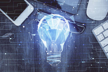 Double exposure of bulb drawing over table with phone. Top view. Concept of idea.の写真素材