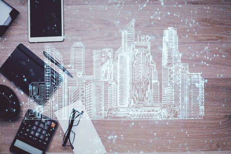Double exposure of city drawing and work table top veiw. Concept of tech in live.の写真素材