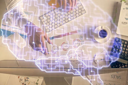 Double exposure of man's hands typing over computer keyboard and brain hologram drawing. Top view....