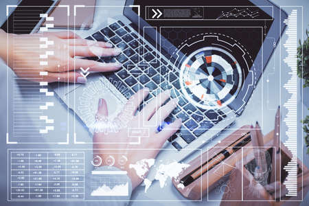 Double exposure of woman hands working on computer and data theme hologram drawing. Tech concept.