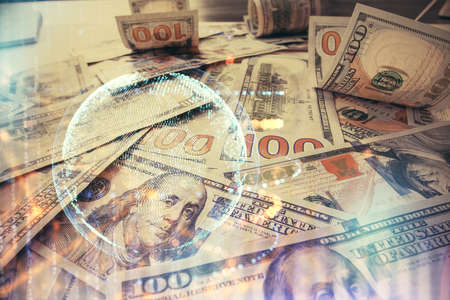 Double exposure of world map drawing over us dollars bill background. International concept.の写真素材