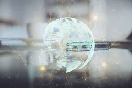 Double exposure of social network theme drawing hologram over coffee cup background in office. Concept people connection.の写真素材