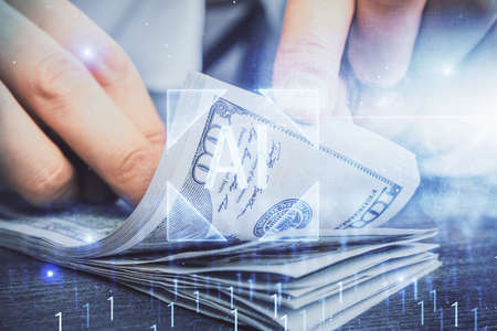 Double exposure of technology drawing hologram and us dollars bills and man hands. Data concept