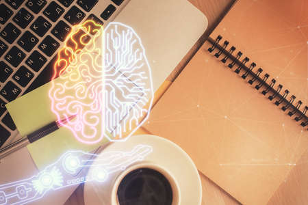 Double exposure of brain drawing hologram over topview work table background with computer. Concept...