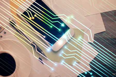 Double exposure of technology theme drawing over work table desktop. Top view. Global data analysis...
