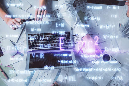Double exposure of man and woman working together and math formulas hologram drawing. Education...