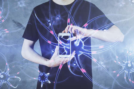 Double exposure of man's hands holding and using a phone and neuron drawing. Education concept.の写真素材