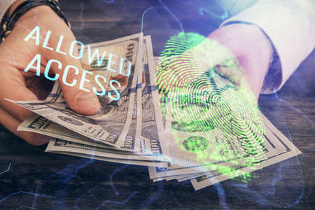 Multi exposure of fingerprint drawing hologram and USA dollars bills and man hands. security...