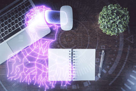 AR hologram drawings over computer on the desktop background. Top view. Multi exposure. Concept of augmented reality.の写真素材