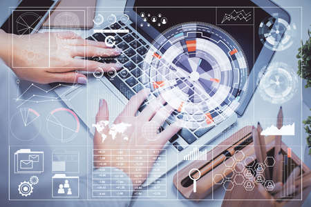 Double exposure of woman hands working on computer and data theme hologram drawing. Tech concept.