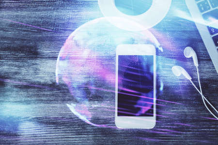 Multi exposure of technology theme drawing over table with phone. Top view. Concept of hightech.の写真素材