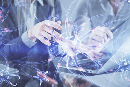 Double exposure of man and woman working together and neuron hologram drawing. Education concept....