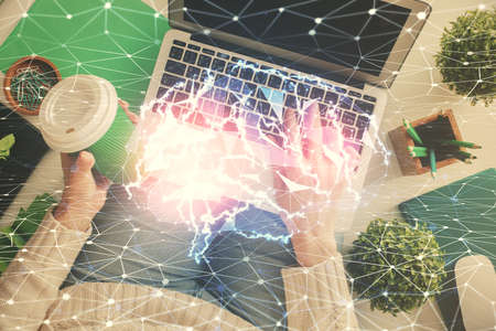 Double exposure of woman working on computer andhuman brain hologram drawing. Top View. Ai concept.