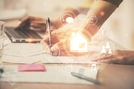 Double exposure of woman hands typing on computer and buildings drawing. Smart-city concept.