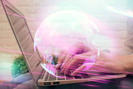 Double exposure of woman hands typing on computer and technology theme drawing. High Tech concept.の写真素材