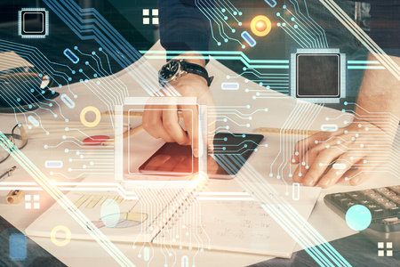 Double exposure of man's hand holding and using a digital device and data theme drawing. Technology...