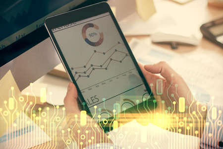 Multi exposure of man's hands holding and using a digital device and data theme drawing. Innovation...