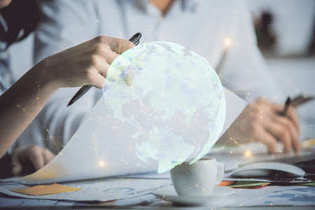 Double exposure of social network theme drawing over people taking notes background. Concept of...