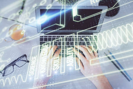 Double exposure of man's hands typing over computer keyboard and science theme hologram drawing. Top view. Education concept.の写真素材