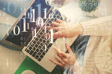Double exposure of woman hands working on computer and data theme hologram drawing. Top View....
