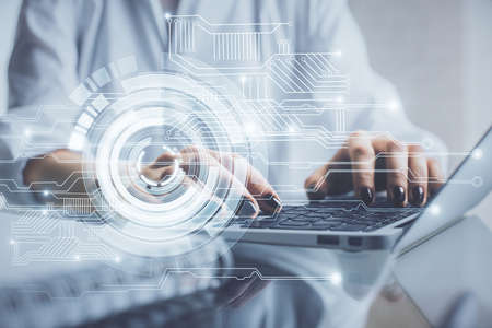 Double exposure of woman hands working on computer and data theme hologram drawing. Tech concept.の写真素材