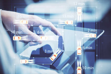 Double exposure of man's hands holding and using a digital device and automobile theme hologram...