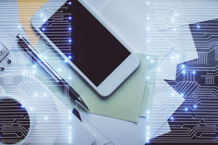 Multi exposure of technology theme drawing over table with phone. Top view. Concept of hightech.の写真素材