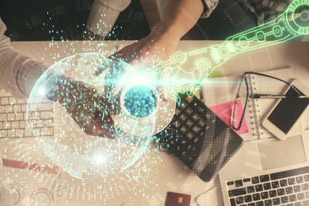 Double exposure of man and woman working together and data theme hologram drawing. Computer...